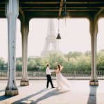 Couple Dancing on Bridge Overlooking Eiffel Tower