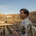 Tourist with a Camera in the Colosseum