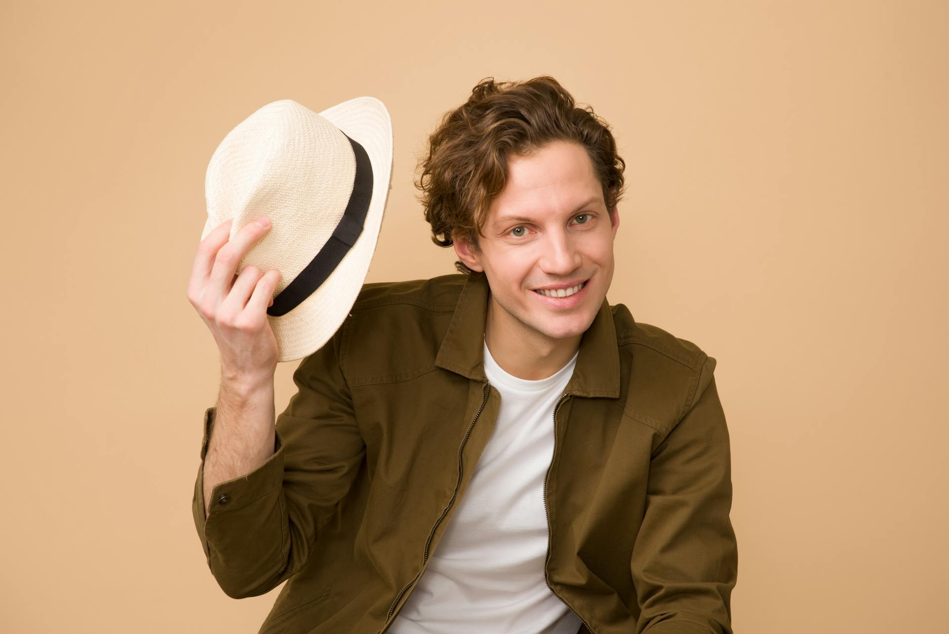 Man Holding Hat and Nodding 