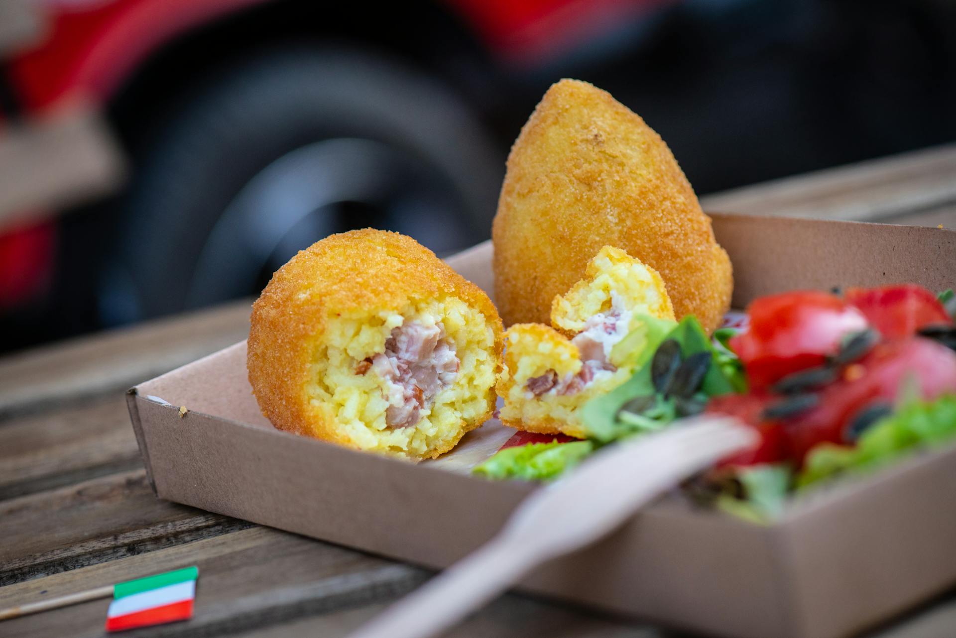 Traditional Italian Arancini in a Box with a Salad