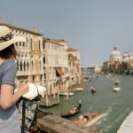 Woman Sketching Canal From Bridge in Venice, Italy