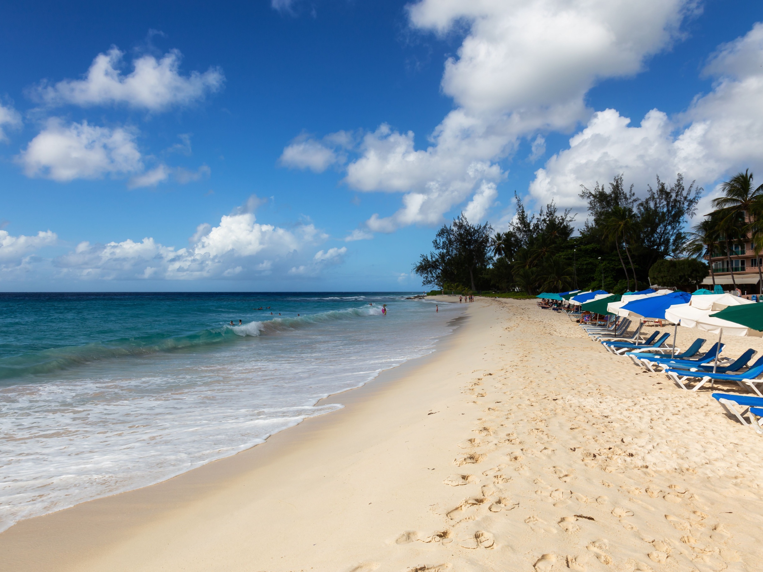 Bridgetown, Christ Church, Barbados - December 2, 2019: Beautiful White Sandy Shore at Rockley Beach during a sunny and cloudy day.