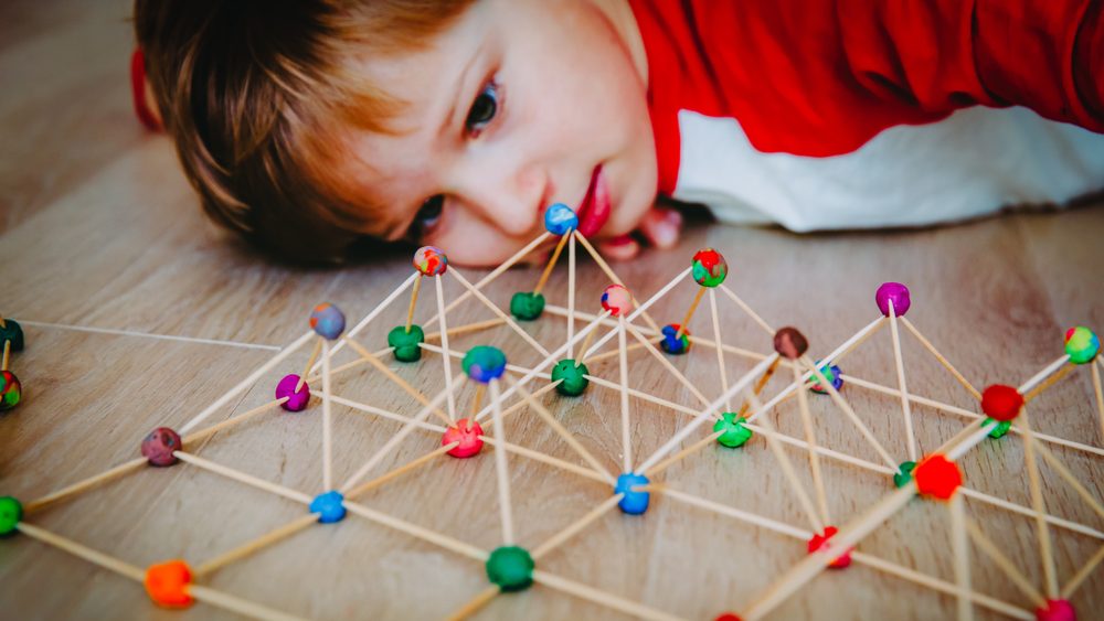 Child making geometric shapes, engineering and STEM