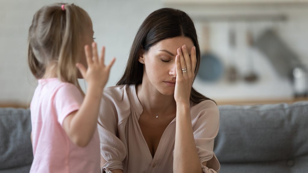 Tired single mother feel stressed desperate about screaming stubborn kid daughter tantrum, frustrated depressed young adult mom annoyed by naughty difficult rebellious child girl problems concept