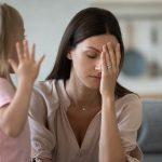 Tired single mother feel stressed desperate about screaming stubborn kid daughter tantrum, frustrated depressed young adult mom annoyed by naughty difficult rebellious child girl problems concept
