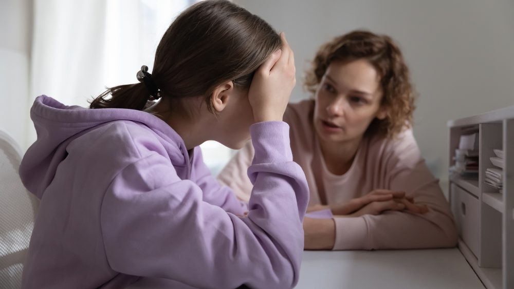Strict mother scolding upset depressed teenage daughter for bad marks or school exam results, angry mum lecturing lazy unmotivated teen girl, generations, parent and child conflict