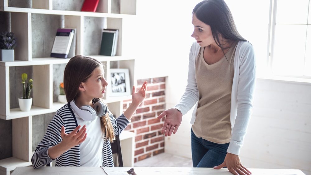 Troubled teenage girl and her mom are quarreling at home