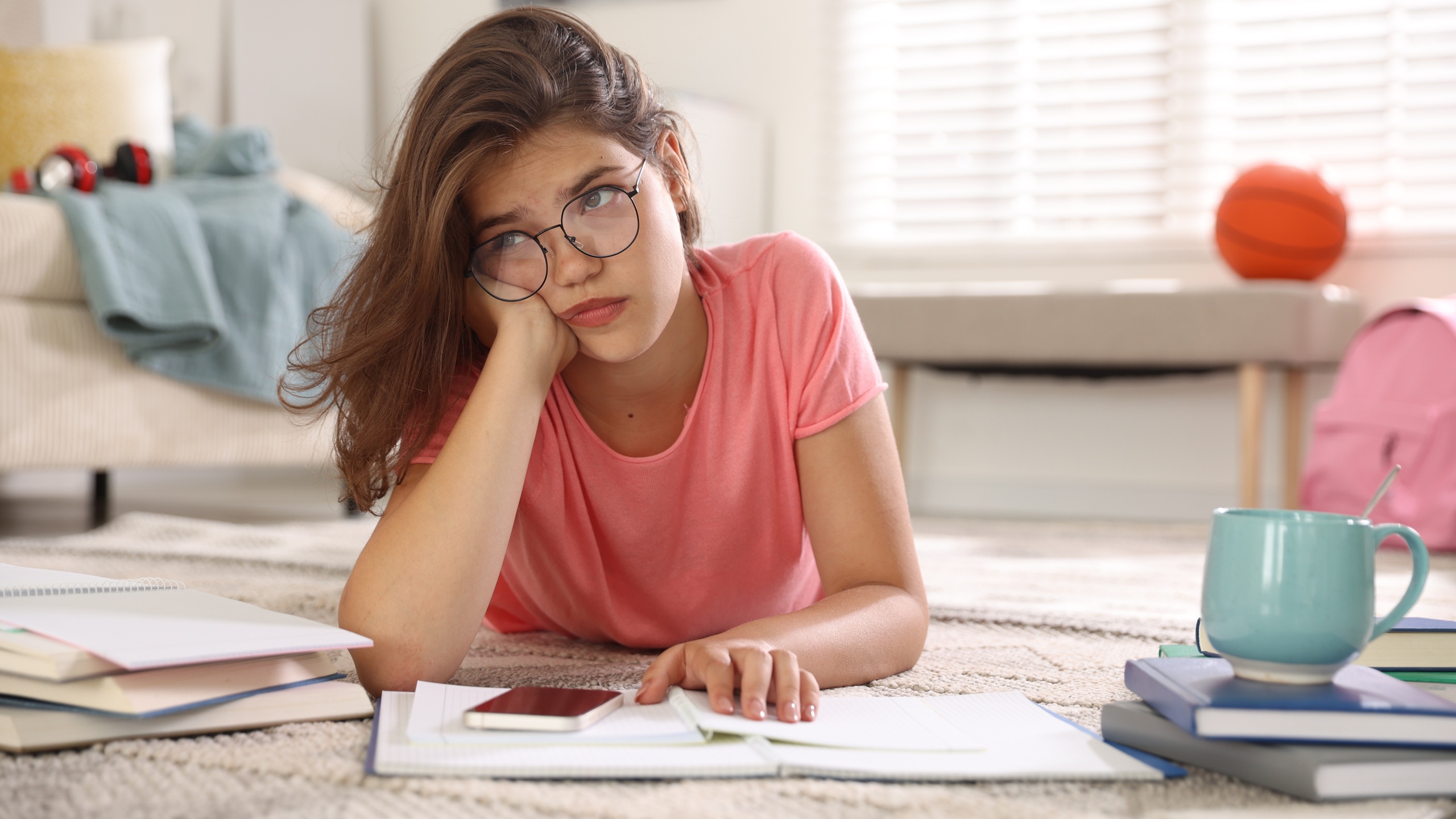 Tired student preparing for exam at home