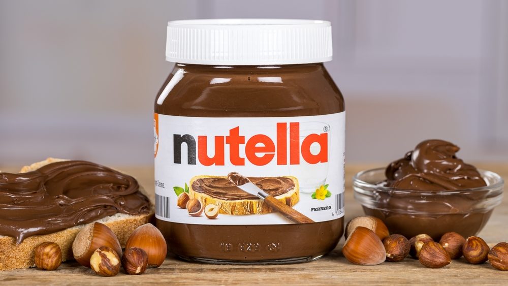 Nutella hazelnut cocoa spread on bread 450g jar with company logo in Stuttgart, Germany.