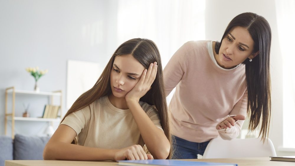 Strict mother has quarrel with her teenage daughter, lecturing her about something, arguing with silent ignoring stubborn girl, have family conflict. Children, parents and relationships concept