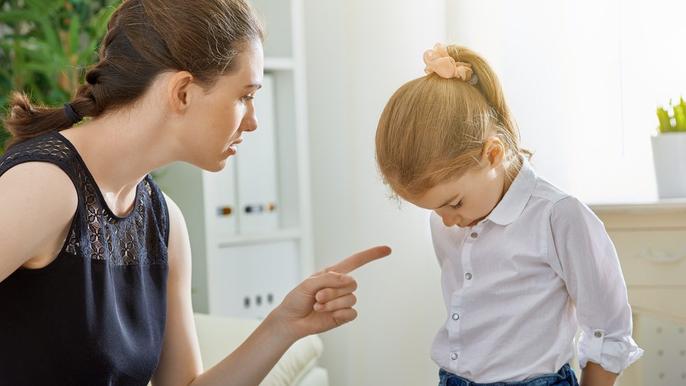 Mother scolds her child