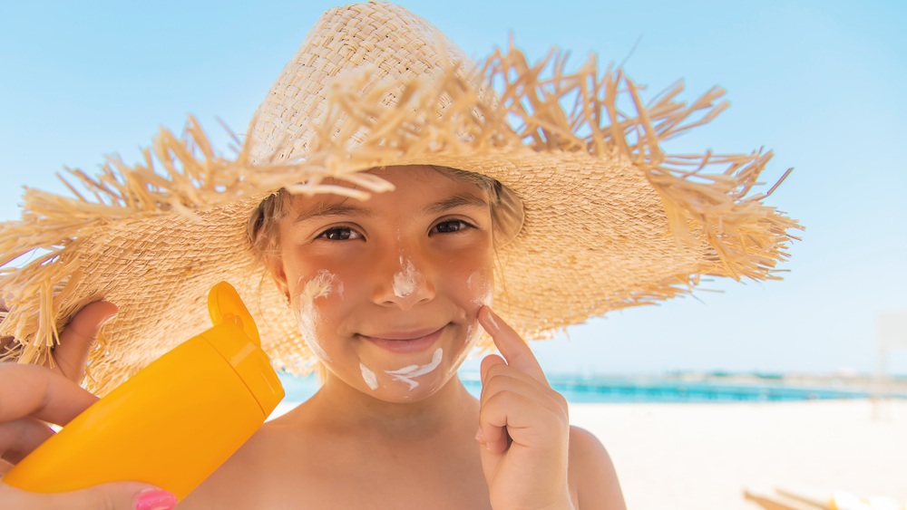 Sunscreen on the skin of a child. Selective focus.