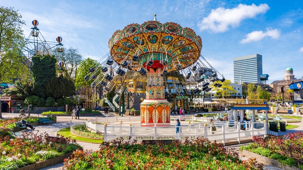 COPENHAGEN, DENMARK - APRIL 15 2024: Tivoli Gardens in Copenhagen is the world's second-oldest, 19th-century amusement park with antique roller coaster and live entertainment program.