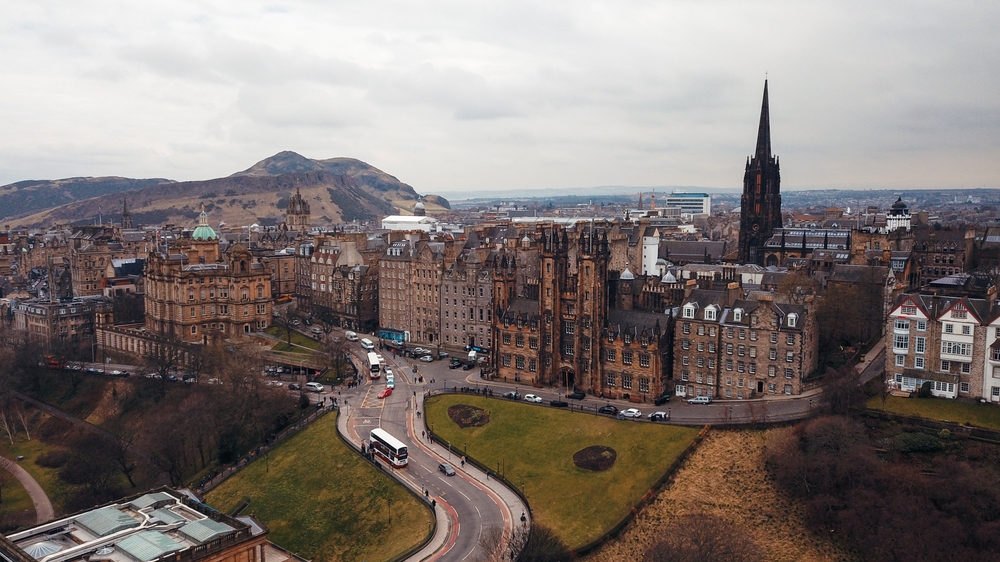 Stunning view of Edinburghs historic architecture against a backdrop of Arthurs Seat