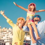 Happy family traveling. People having fun in old european town. Summer holiday and vacation concept