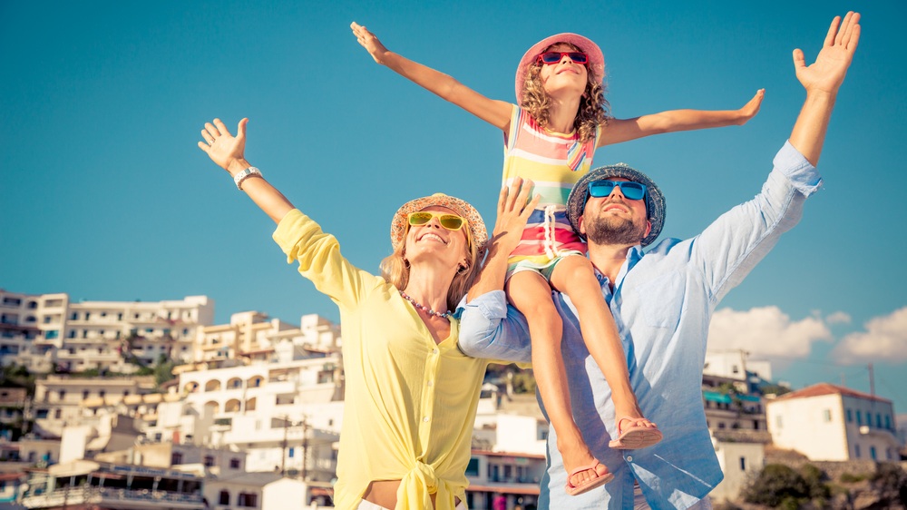 Happy family traveling. People having fun in old european town. Summer holiday and vacation concept